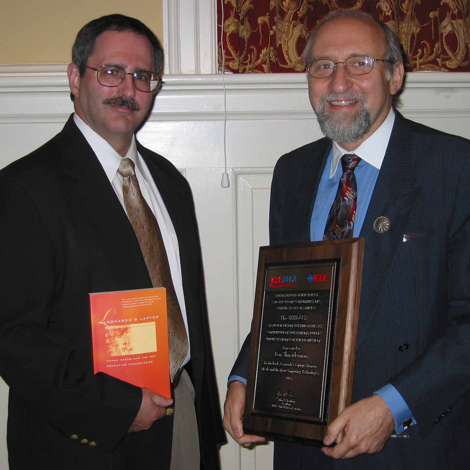 Received the IEEE Distinguished Literary Contribution Award for 'Leonardo's Laptop' presented by Daniel Benigni of the IEEE during the HCIL Open House, Photo by Sharmon Kollet, June 4, 2004