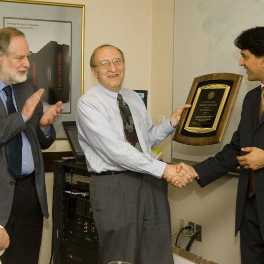 Receiving the 2008 Board of Visitors Award from the College of Computer, Mathematical and Physical Sciences at the University of Maryland. Board Chair Raj Khera presents the Award, while Dean Stephen Halperin and Prof. James Yorke applaud, May 16, 2008