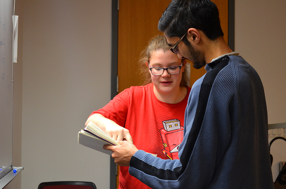 Amelia helps a student during her discussion section.