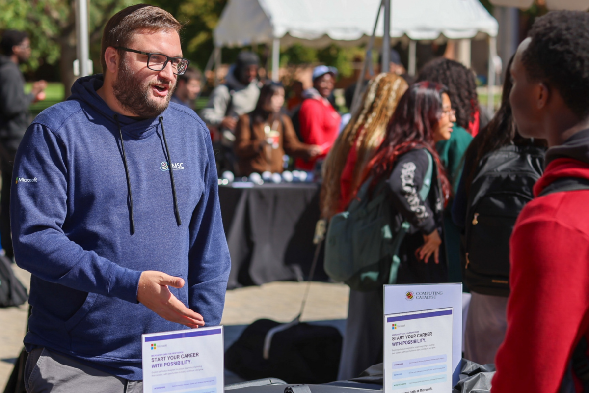 2 people talking at the MSC table