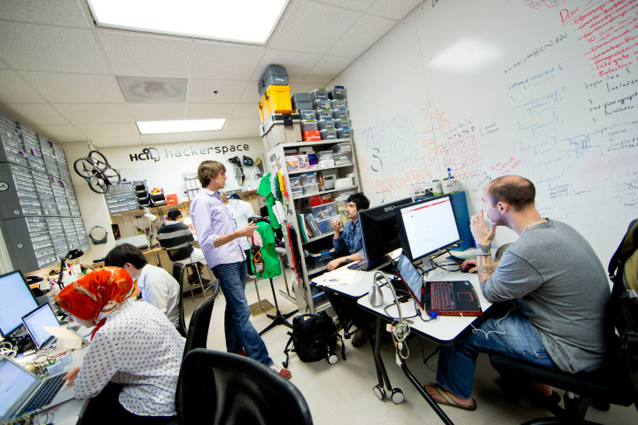 photo of Jon working with his students-- photo by John T. Consoli 