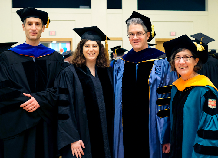 photo of (From left) Lujo Bauer, Michelle Mazurek, Greg Ganger and Lorrie Cranor at Mazurek’s 2014 Ph.D. commencement ceremony.