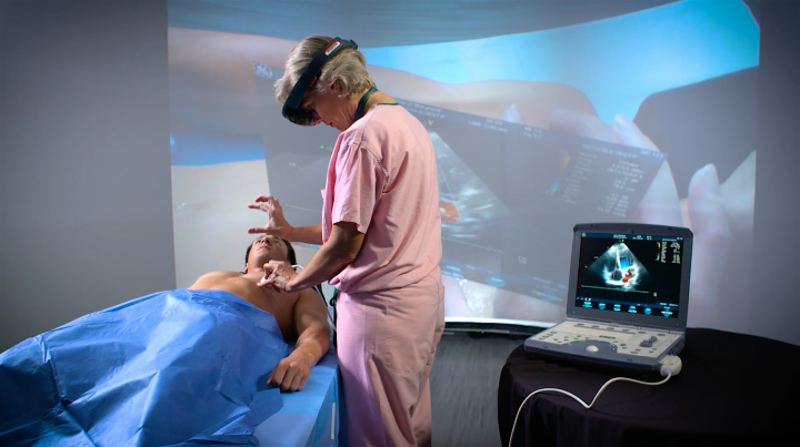 photo of Dr. Sarah Murthi tests an augmented reality prototype that overlays ultrasound data directly on the patient. Photo courtesy of Maryland Blended Reality Center